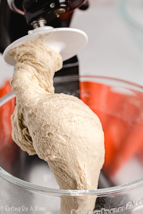 Close up image of dough on a dough hook. 