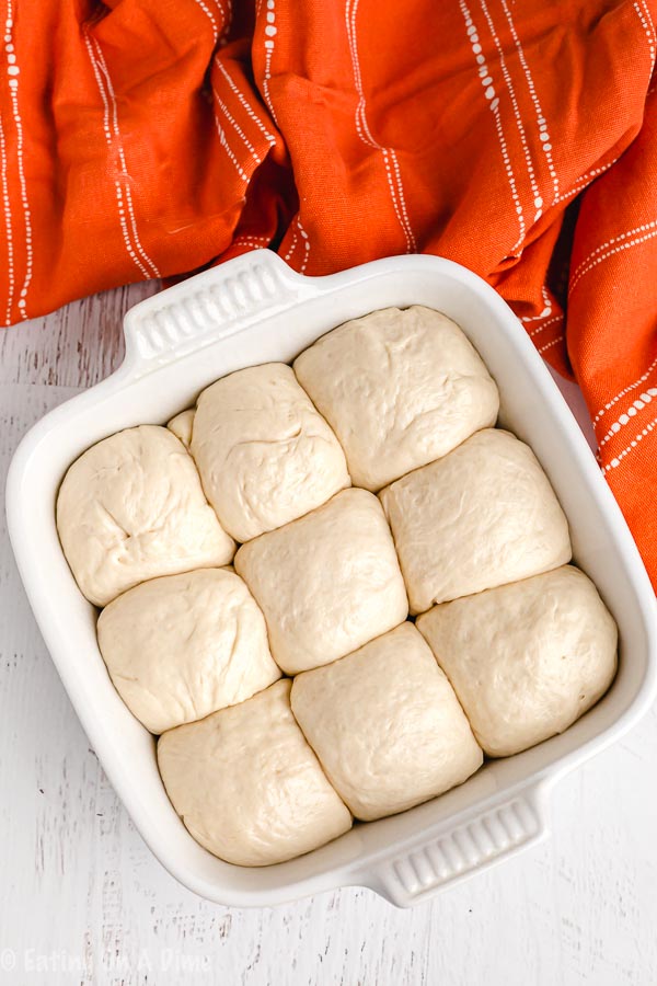 close up image of a pan of hawaiian rolls in process. 
