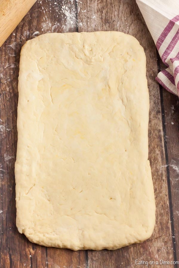 Rolling the dough out on a floured surface