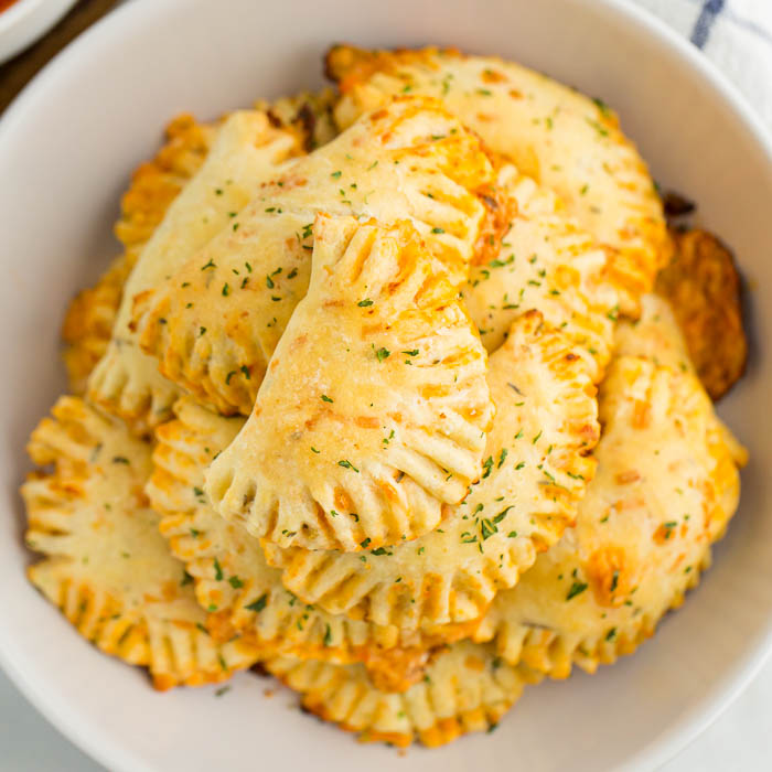 Pizza Pockets stacked in a bowl