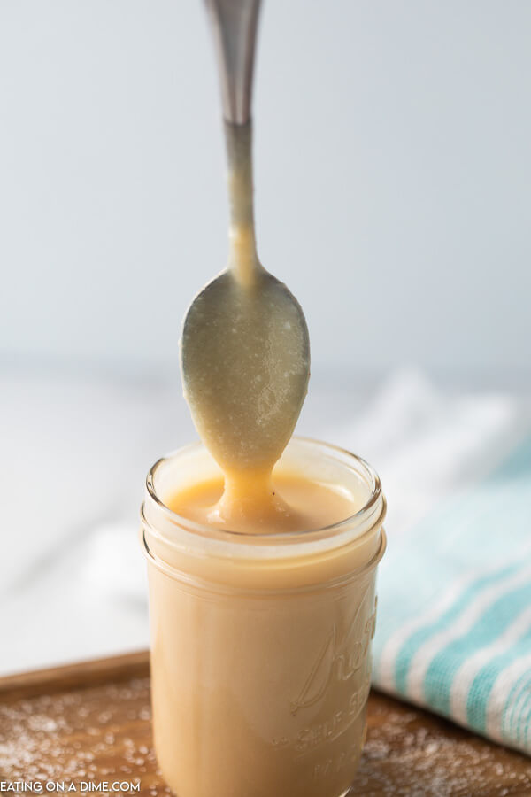Homemade sweetened condensed milk is super easy to make with only 4 ingredients. Learn how to make this at home to save money. 