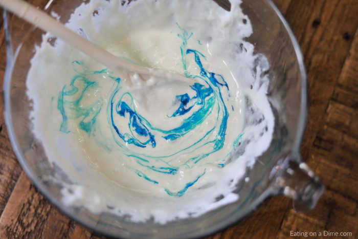Add blue food coloring to the melted marshmallows