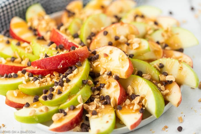 Try easy caramel apple nachos recipe for a treat. Layers of crispy apples topped with decadent caramel sauce come together for a tasty snack. 