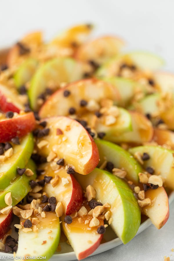 Try easy caramel apple nachos recipe for a treat. Layers of crispy apples topped with decadent caramel sauce come together for a tasty snack. 