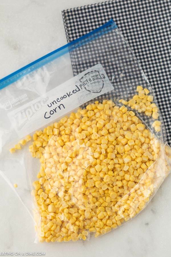 Freezer bag with uncooked corn kernels.