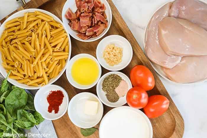 Ingredients - Chicken Breast, bacon, olive oil, garlic, butter, tomatoes, spinach, paprika, Italian seasoning, salt, pepper, heavy whipping cream, parmesan cheese, penne pasta
