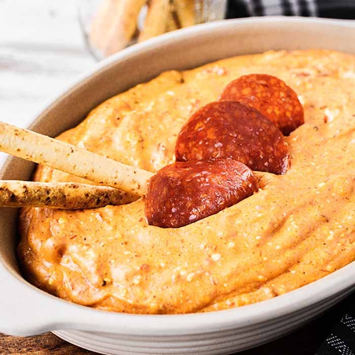 Pepperoni Pizza Dip will be an instant hit! Don't wait for your next party to enjoy this creamy pizza dip! It is the perfect low-carb version of pizza!