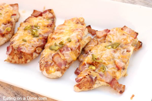 Bacon lovers will go crazy over this easy Bacon bbq chicken recipe. Layers of delicious cheese, BBQ sauce and bacon make this chicken tasty.