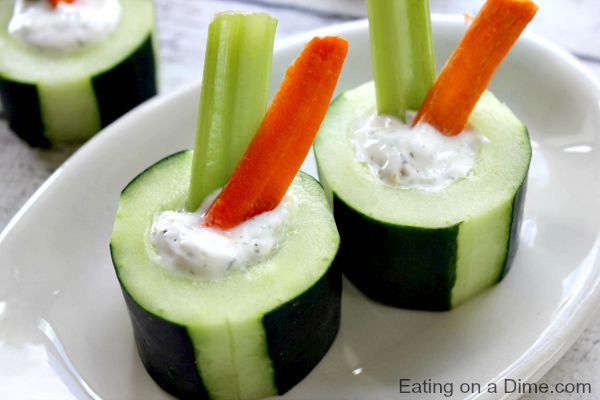 cucumber bites with dip , carrots and celery