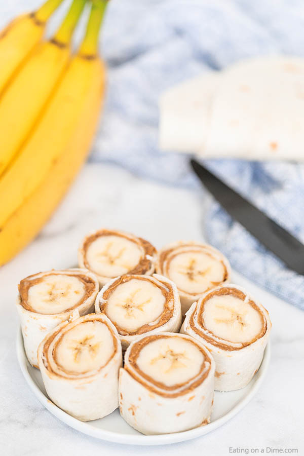 You have to try this easy Banana Peanut Butter Roll ups for an easy after school snack. These 3 ingredient banana peanut butter rolls are always a favorite!