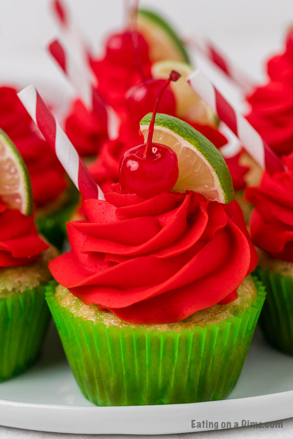 Closeup picture of cherry limeade cupcake in a green cupcake liner