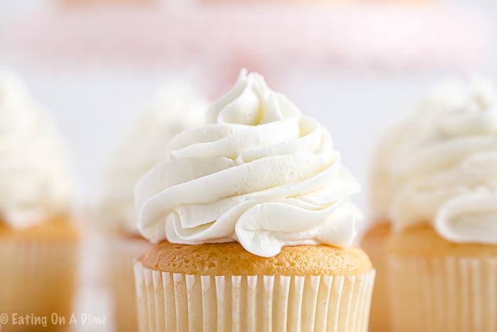 Once you learn how to make buttercream icing you'll never buy store-bought icing ever again! Fluffy and perfect vanilla buttercream frosting every time! This will be your favorite easy vanilla buttercream frosting recipe. Learn how to make the best buttercream frosting recipe easy! #eatingonadime #frostingrecipes #icingrecipes