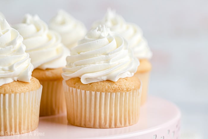 Once you learn how to make buttercream icing you'll never buy store-bought icing ever again! Fluffy and perfect vanilla buttercream frosting every time! This will be your favorite easy vanilla buttercream frosting recipe. Learn how to make the best buttercream frosting recipe easy! #eatingonadime #frostingrecipes #icingrecipes