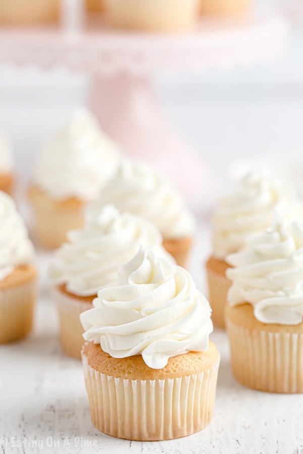 Once you learn how to make buttercream icing you'll never buy store-bought icing ever again! Fluffy and perfect vanilla buttercream frosting every time! This will be your favorite easy vanilla buttercream frosting recipe. Learn how to make the best buttercream frosting recipe easy! #eatingonadime #frostingrecipes #icingrecipes