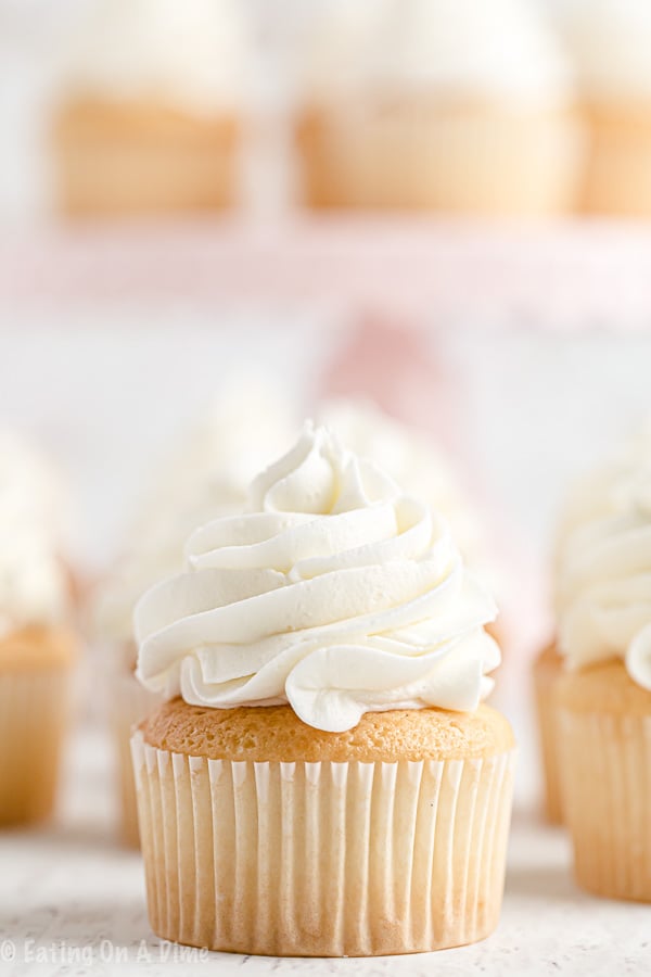 Once you learn how to make buttercream icing you'll never buy store-bought icing ever again! Fluffy and perfect vanilla buttercream frosting every time! This will be your favorite easy vanilla buttercream frosting recipe. Learn how to make the best buttercream frosting recipe easy! #eatingonadime #frostingrecipes #icingrecipes