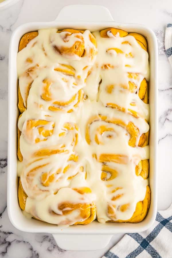 Pumpkin cinnamon rolls in a baking dish