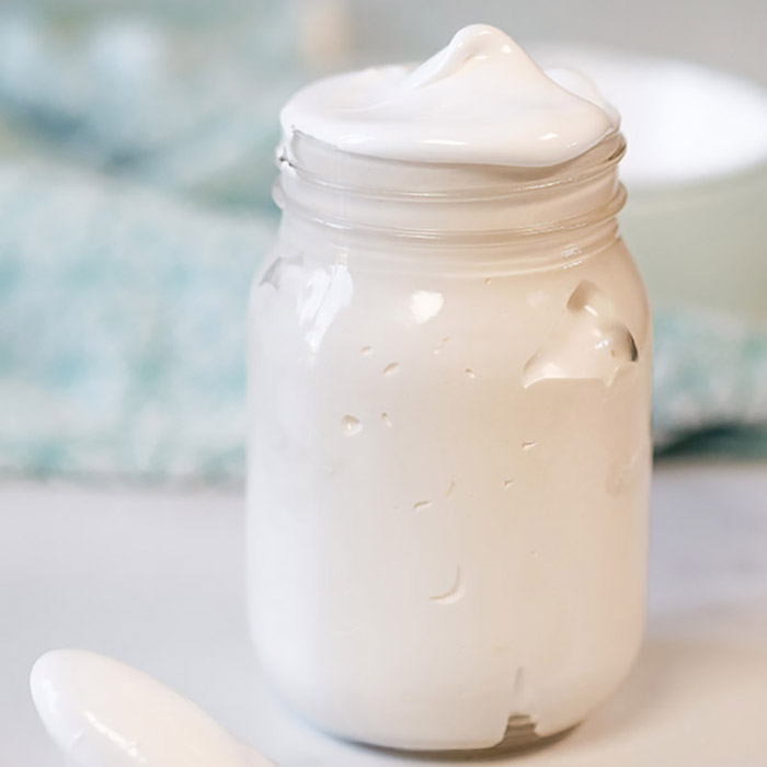 Close up image of Marshmallow Cream in a mason jar. 