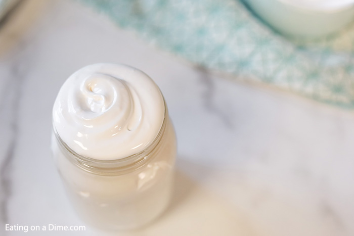Close up image of Marshmallow Cream in a mason jar. 