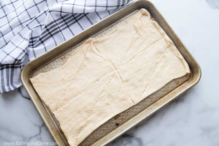 Spreading the dough on a baking sheet