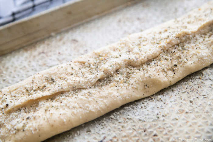 Uncooked dough seasoned on a baking sheet