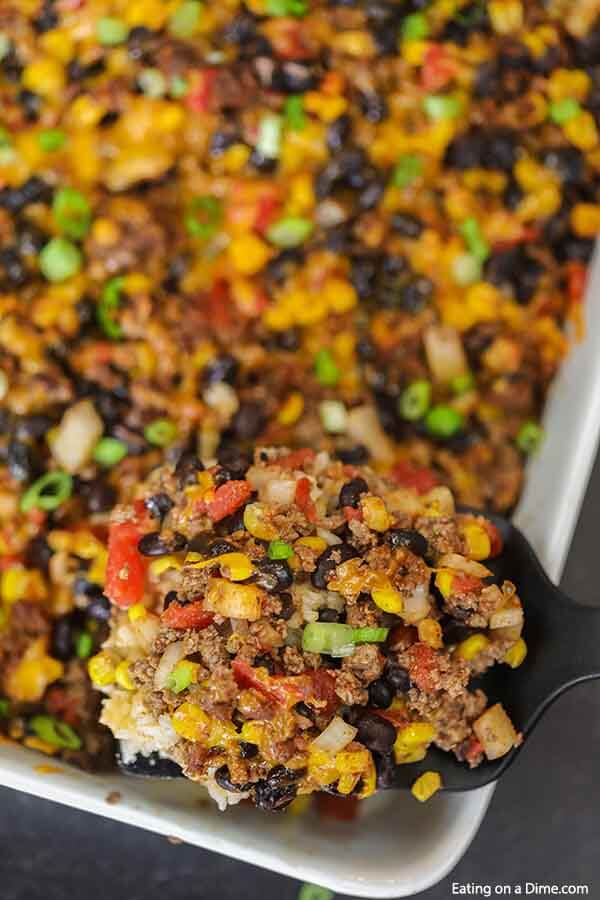 Taco rice casserole is an easy dinner idea and freezer friendly. It is a great recipe to stretch your meat and budget friendly.  #eatingonadime #mexicanrecipes #casserolerecipes #recipeseasy #freezermeals 