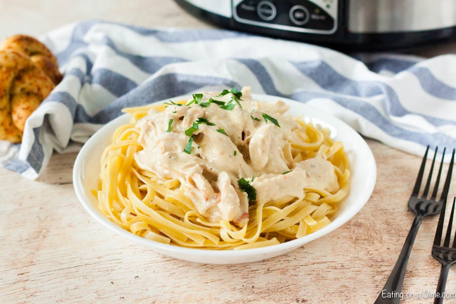 Crock Pot Chicken Alfredo is easy to make and delicious. You can enjoy Crock Pot Chicken Fettuccine Alfredo any day of the week thanks to the slow cooker!