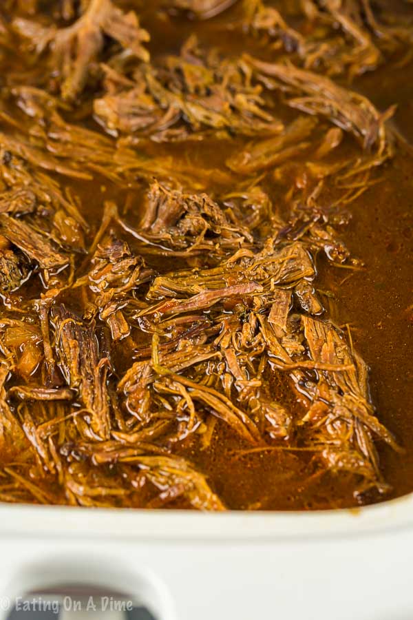 Enjoy Crock pot shredded beef tacos loaded with tender beef. The slow cooker does all of the work and all you need to do is add your favorite toppings! 