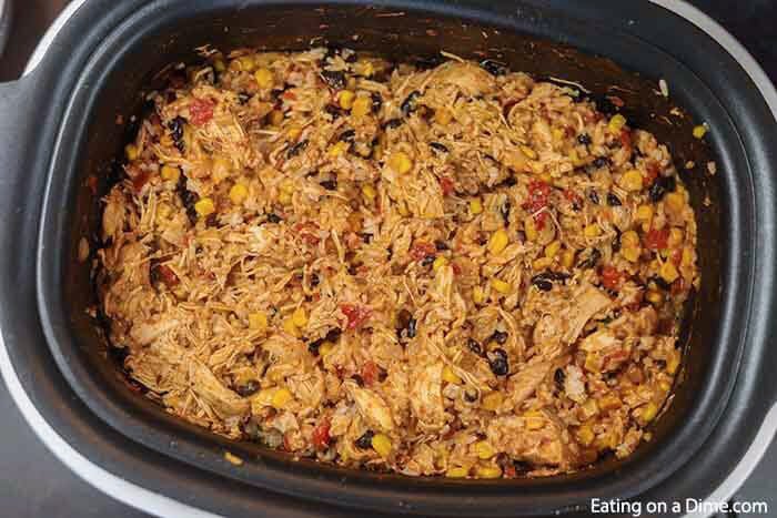 This cheesy and delicious Southwest crock pot chicken and rice recipe is so easy in the slow cooker. Come home to the best comfort food!