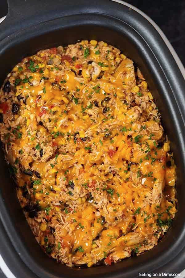 This cheesy and delicious Southwest crock pot chicken and rice recipe is so easy in the slow cooker. Come home to the best comfort food!