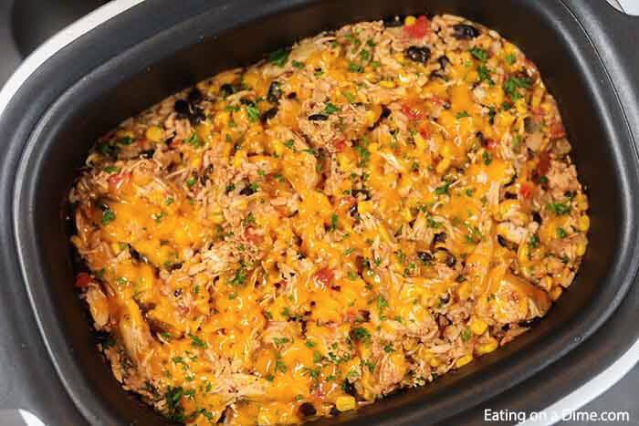 This cheesy and delicious Southwest crock pot chicken and rice recipe is so easy in the slow cooker. Come home to the best comfort food!