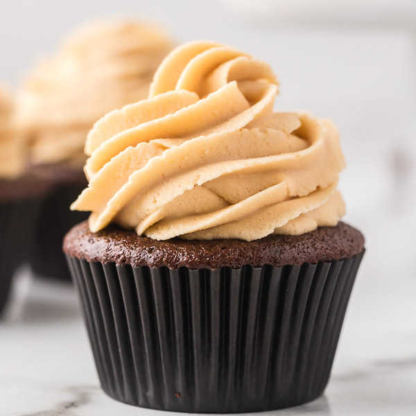 Close up image a chocolate peanut butter cupcake.