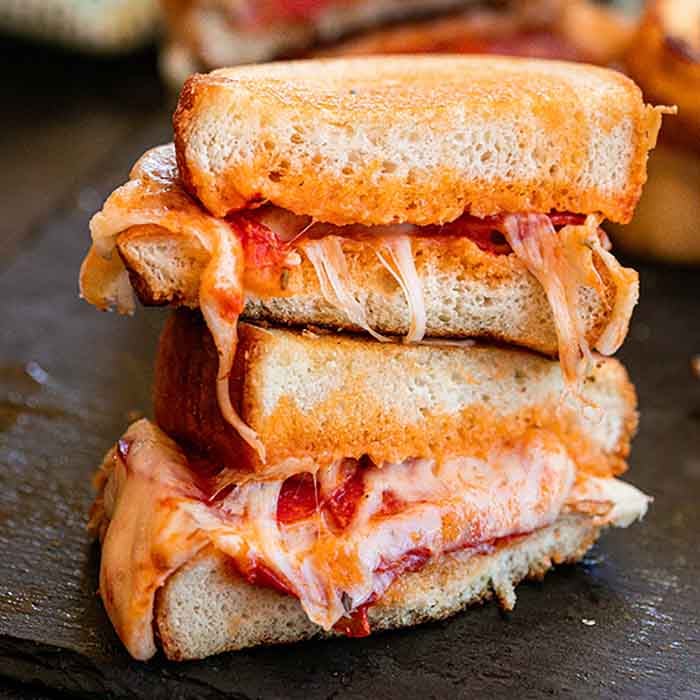 Jazz up plain grilled cheese with this delicious pizza grilled cheese sandwich recipe. Texas Toast makes this super easy. Your kids will go crazy over this!