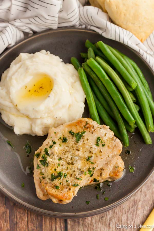 Busy week nights are made easier with this simple but delicious Crockpot Ranch Pork Chops recipe. Each bite is so tender and the flavor is amazing.