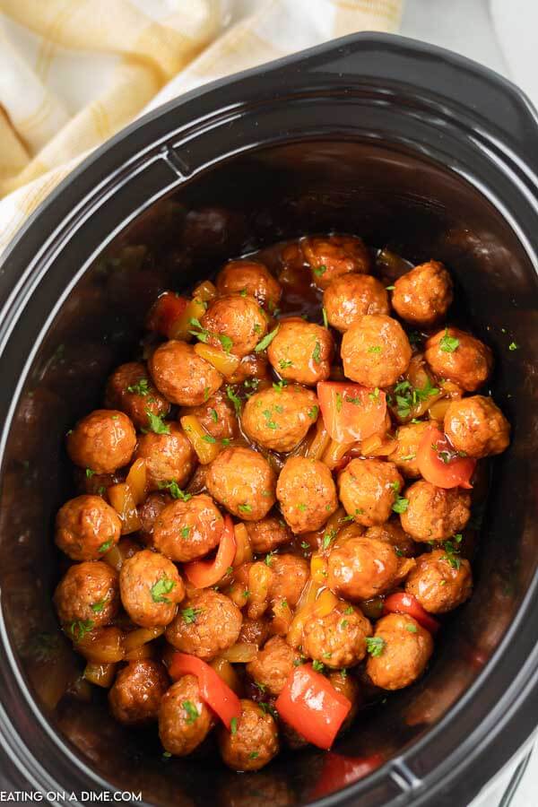 Crock pot sweet and sour meatballs have a delicious combination of flavors that you will love. Serve over rice for a quick dinner idea. 