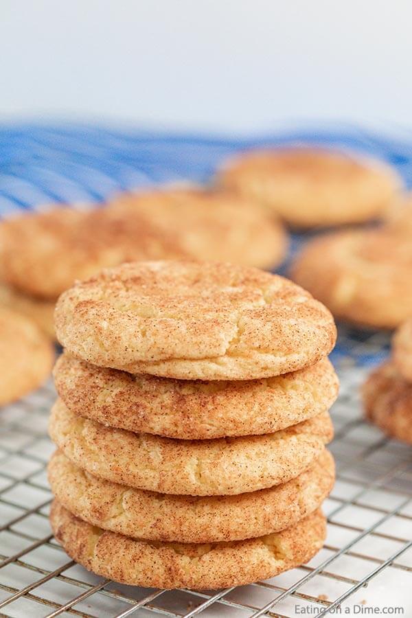 Make this easy Snickerdoodle cake mix cookies recipe for a decadent treat. Each bite is soft and fluffy and the secret is a cake mix!  #eatingonadime #cookierecipes #cakemixcooikies #snickerdoodles 