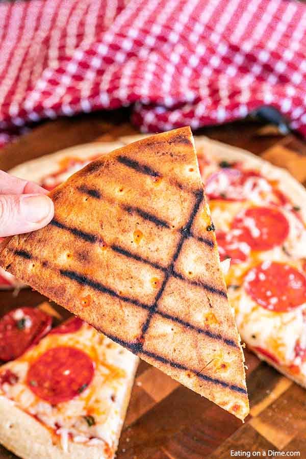 Close up image of grilled pizza with a close up image of a slice of pizza with grill marks