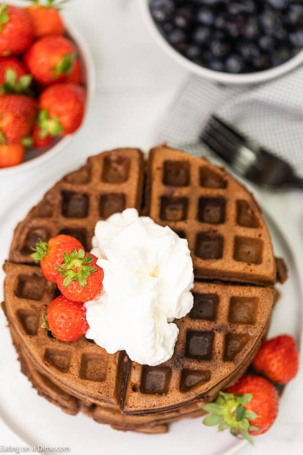 This cake mix waffles recipe is so fun and easy for the kids to make. These cake mix waffles boxes recipe can be made with your favorite flavors: funfetti, chocolate and strawberry. Learn how to make this cake mix waffles recipe with a box cake mix. This recipe is so easy, your kids can make this recipe boxes of cake mix waffles! #eatingonadime #cakemixrecipes #cakemixwaffles #easydesserts #kidrecipes 