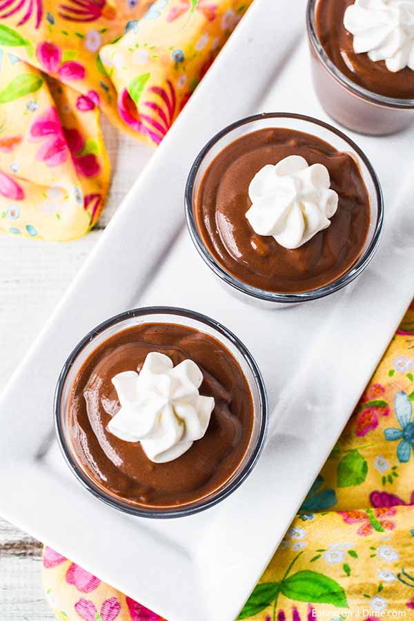 Chocolate Pudding in glasses topped with whipped cream