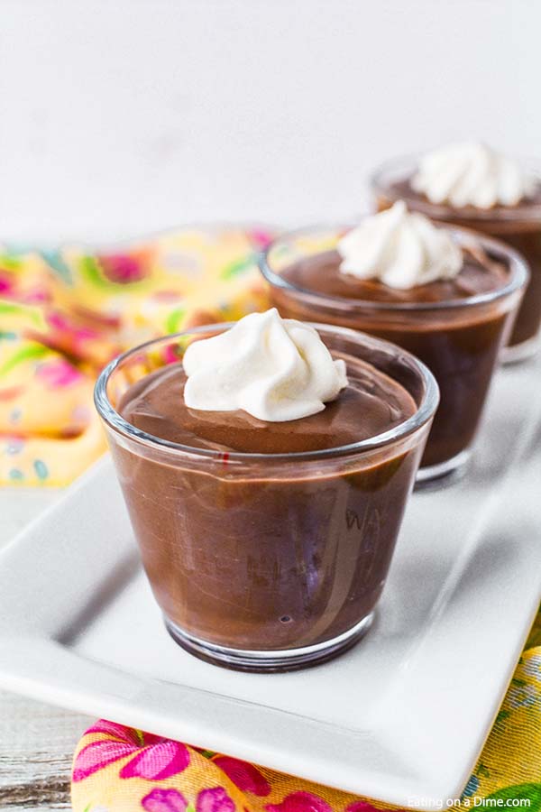 Chocolate Pudding in glasses topped with whipped cream 