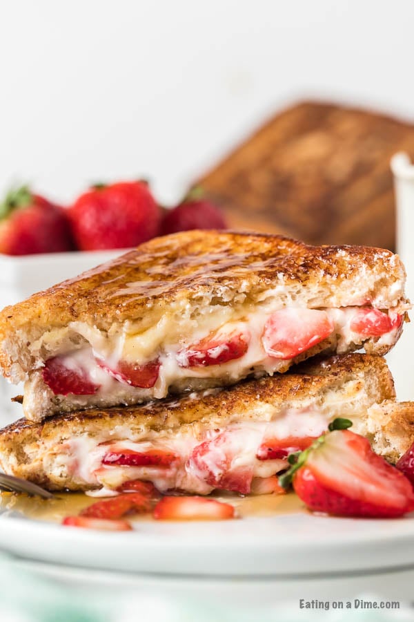 This stuffed French toast with strawberry and cream cheese is easy to make and the best stuffed French toast recipe. Learn how to make this easy strawberry, homemade stuffed French toast cream cheese recipe. This recipe easy is one of my favorite breakfast recipes! The filling in this stuffed French toast is packed with flavor and makes this French toast amazing! #eatingonadime #frenchtoastrecipes #breakfastrecipes #easyrecipes 