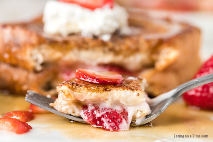 This stuffed French toast with strawberry and cream cheese is easy to make and the best stuffed French toast recipe. Learn how to make this easy strawberry, homemade stuffed French toast cream cheese recipe. This recipe easy is one of my favorite breakfast recipes! The filling in this stuffed French toast is packed with flavor and makes this French toast amazing! #eatingonadime #frenchtoastrecipes #breakfastrecipes #easyrecipes 