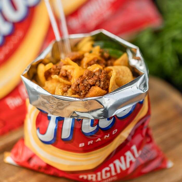 closeup photo of a bag of fritos with chili.