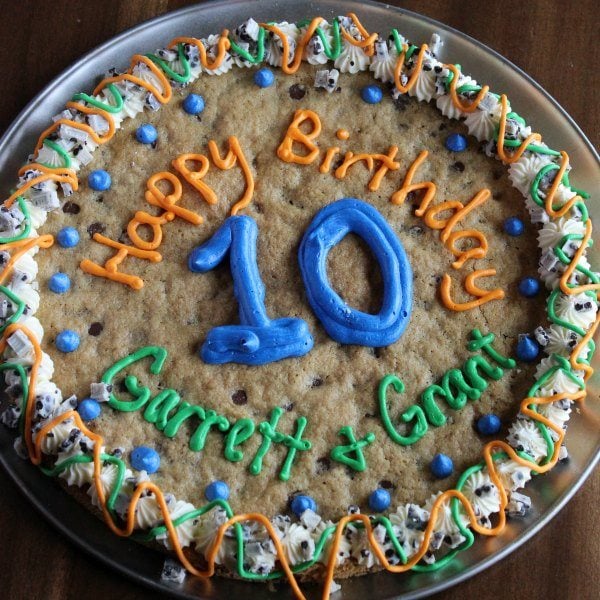 Skip the bakery and learn how to make this giant cookie recipe at home. Try this for birthdays, holidays and more for a great dessert. 