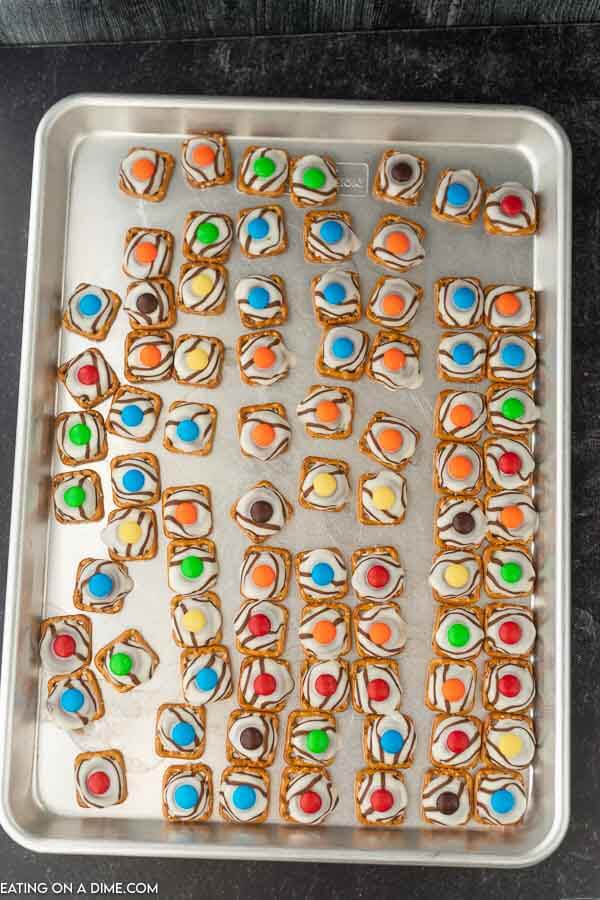 photo of baking sheet with hershey kisses pretzels