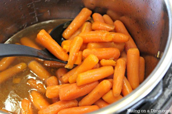 Baby Carrots in the instant pot with a spoon