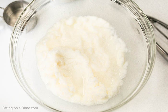 Close up image of snow ice cream in a clear bowl. 