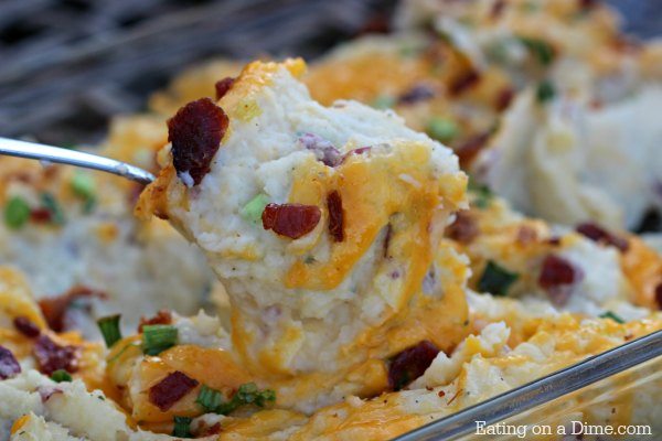 This Instant Pot Twice Baked Potatoes Casserole Recipe is amazing! You are going to love this easy pressure cooker loaded baked potato casserole recipe.  This recipe is the best to make ahead so that you can easily make it for a crowd or for the holidays.  #eatingonadime #instantpotrecipes #pressurecookerrecipes #sidedishes 