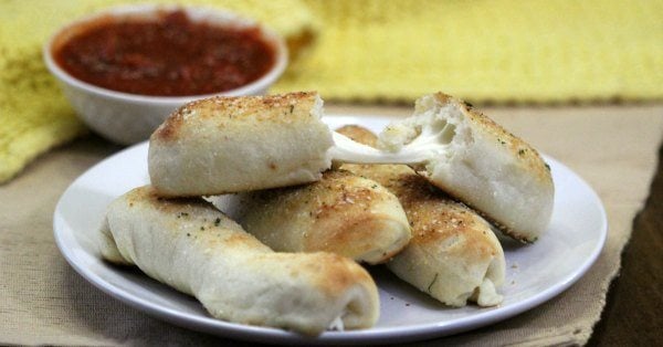 Everyone will love it when you serve this Garlic Bread Cheese Sticks Recipe. Garlic bread and melty cheese creates cheese-stuffed garlic breadsticks!