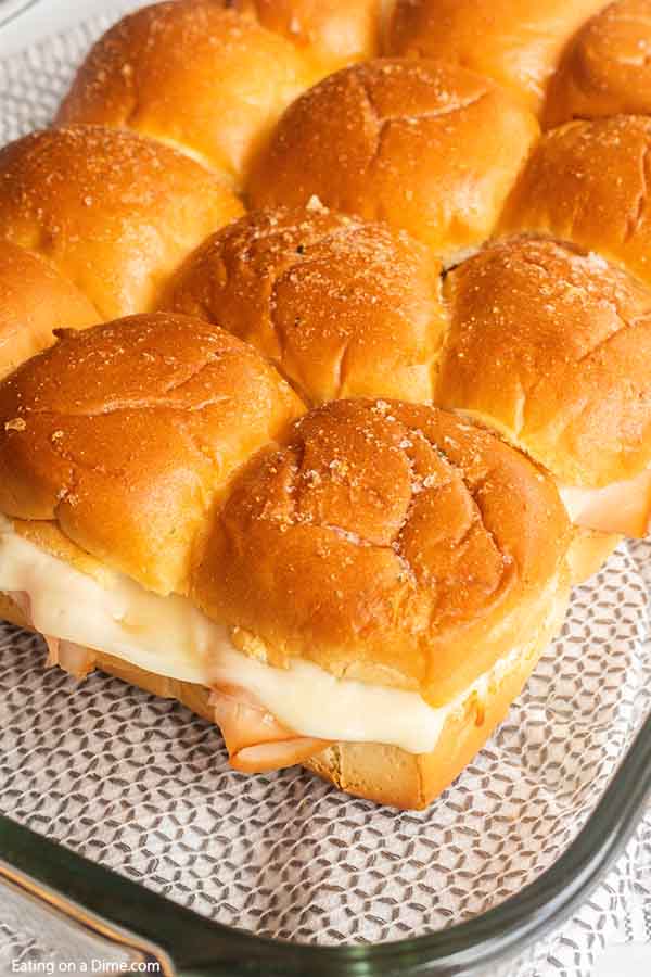 These quick and easy Hawaiian turkey and cheese sliders are the best for feeding a crowd! Hawaiian roll turkey sliders are our go to recipe for party food!