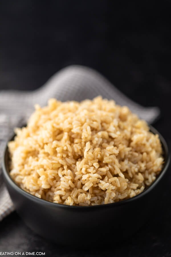 Overview of Cooked Brown rice in a black bowl. 